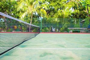 Tennis court on exotic tropical island - sport background photo