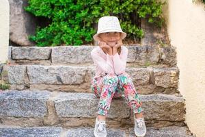 Adorable little girl have fun outdoors photo