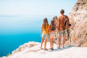 Happy beautiful family on a tropical beach vacation photo