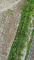 Aerial View of British Roads and Traffic Passing Through City. Drone's Camera Footage in Vertical and Portrait Style video