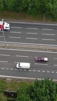 Aerial View of British Roads and Traffic Passing Through City. Drone's Camera Footage in Vertical and Portrait Style video
