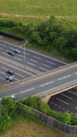 Aerial View of British Roads and Traffic Passing Through City. Drone's Camera Footage in Vertical and Portrait Style video