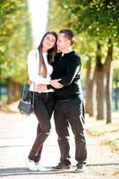 Portrait of happy family of four in autumn day photo