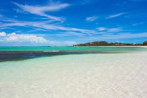 Perfect white beach with turquoise water at ideal island photo