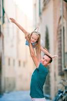 Happy father and little adorable girl in Rome during summer italian vacation photo