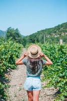 Young woman enjoying nature on the field of sunflowers. photo