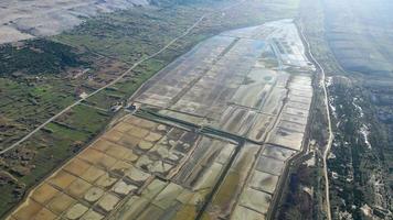 Aerial drone view of Salt Fields in Solana Pag, the largest sea-salt producer in Croatia, and its operations are based on a thousand-year tradition of sea-salt production on the island of Pag. video