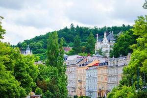 Nice hotels and traditional buildings on sunny town of Karlovy Vary. The most visited spa town in Czech Republic. photo