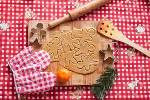 Making gingerbread man and christmas cookies photo