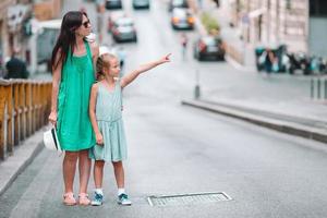 Happy mom and little adorable girl traveling in Rome, Italy photo