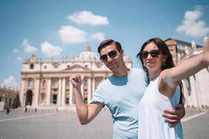 Happy couple at St. Peter's Basilica church in Vatican, Rome. photo