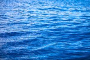 Incredibly clean turquoise water in the sea near tropical island photo