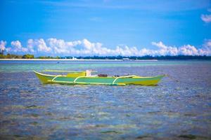 Small Fishing boat in open sea photo