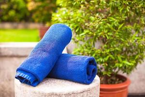Close-up of towels near swimming pool at tropical resort photo