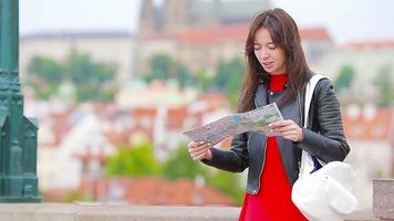 Happy young urban woman drinking coffee in european city. Travel tourist woman with hot drink outdoors during holidays in Europe. video