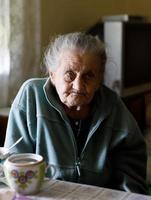 Elderly lonely woman photo