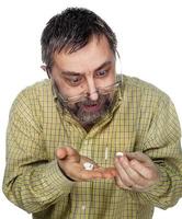 Elderly man with pills photo