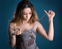 surprised woman looking at her breast photo