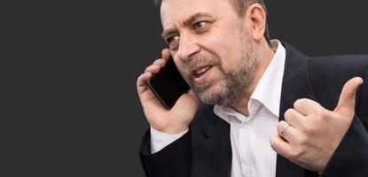 business man speaks on a mobile phone