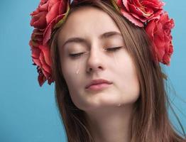 Portrait of young beautiful woman crying photo