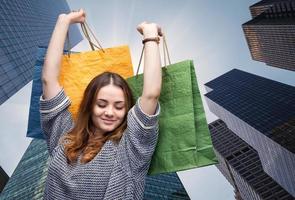 young woman with shopping bags photo