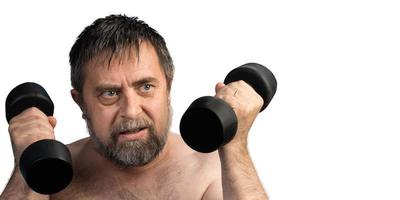 man exercising with dumbbells photo