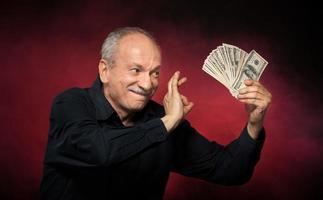 old man with dollar bills photo