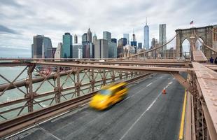 Cars crossing the Brooklyn Bridge in New York photo