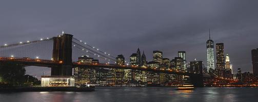 Brooklyn Bridge and Manhattan at sunset photo