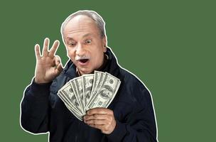 Senior gentleman holding a stack of money photo