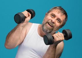 man exercising with dumbbells photo