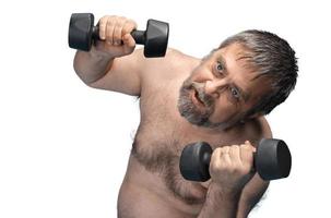 man exercising with dumbbells photo