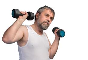 man exercising with dumbbells photo