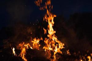 Flames of bonfire at night photo