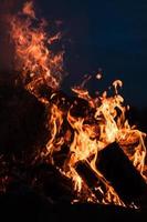 Flames of bonfire at night photo