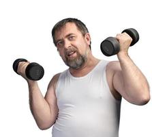 man exercising with dumbbells photo