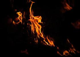 Flames of bonfire at night photo