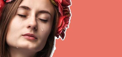 Portrait of young beautiful woman crying photo