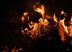 Flames of bonfire at night photo