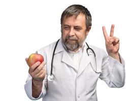 doctor dando manzana para una alimentación saludable foto