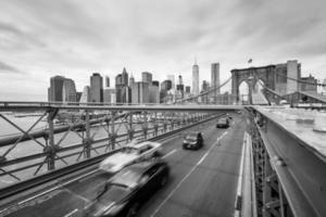 Cars crossing the Brooklyn Bridge in New York photo