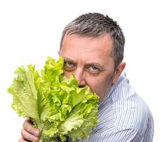 Man holding lettuce isolated on white photo