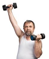 man exercising with dumbbells photo