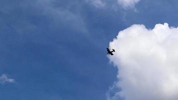 Ultralight small propeller-driven private jet flying in the sky with clouds over the airfield. Rear view of a turboprop aircraft taking off. video