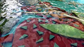 Top view of texture of clean blue surface of pool water with light reflections. Slow motion net, sunlight refraction, water, background. Water caustic background. video