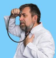 Mad doctor with a stethoscope photo