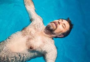Middle-aged man in a swimming pool photo