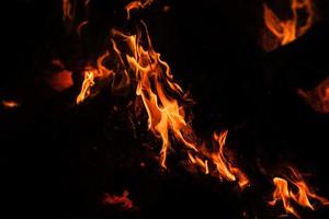 Flames of bonfire at night photo