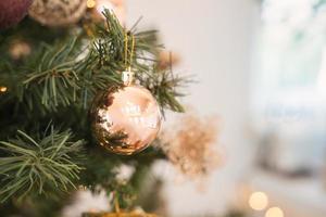 Christmas pine tree with decorative golden ball and bauble ornamental photo