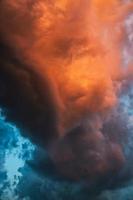 Beautiful dramatic storm clouds in the sunset sky photo